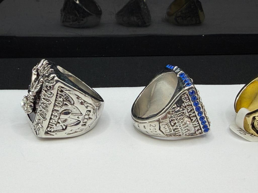THREE NFL CHAMPIONSHIP REPLICA RINGS INCLUDING SEATLE SEAHAWKS SUPER BOWL REPLICA FROM 2013 - 8