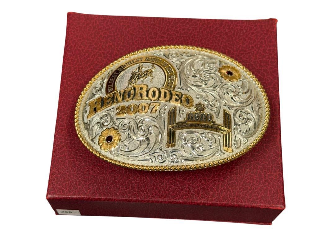 2007 RENO RODEO LIMITED EDITION BEJEWELED AND ENGRAVED BELT BUCKLE BY GIST SILVERSMITHS NO. 239/500: INCLUDES ORIGINAL BOX AND LABEL, BUCKLE APPEARS NEW WITH NO WEAR 4 1/2" X 3 1/2"