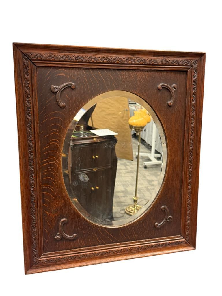 EARLY 20TH CENTURY OAK FRAMED BEVELED MIRROR: DECORATIVE BORDER AND APPLIED MOLDINGS, WORN AREAS ON THE MIRROR 19 1/2" X 21 1/2" FRAME