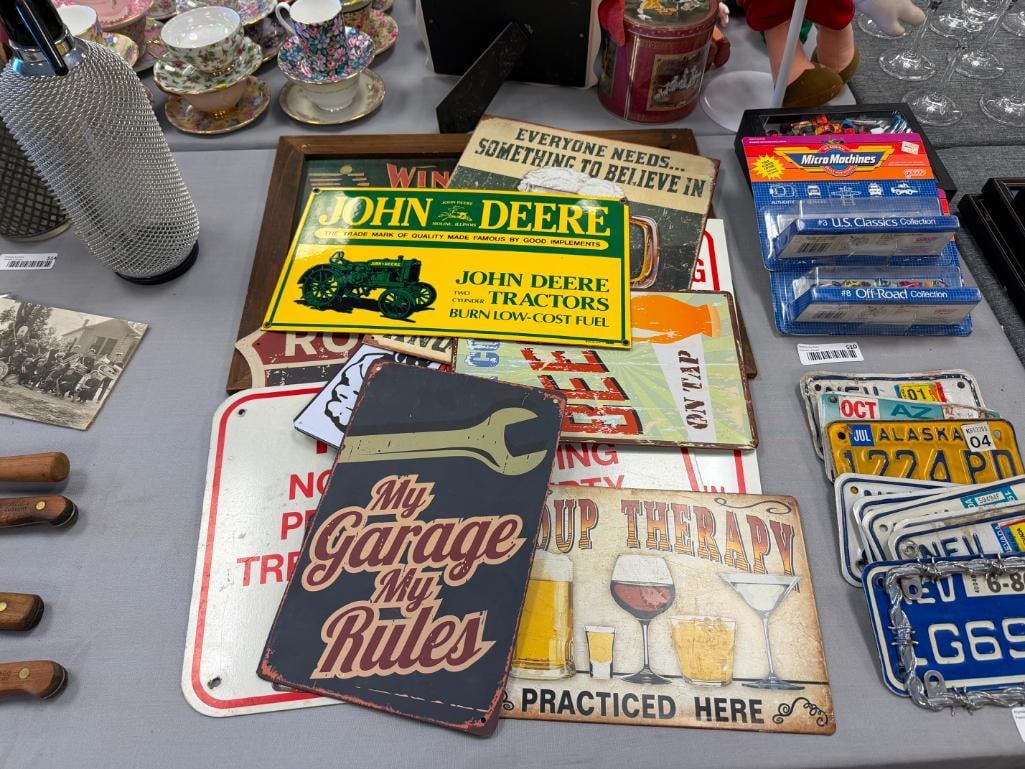 11 ASSORTED GAGAGE / MAN CAVE STYLE DECORATIVE METAL SIGNS INCLUDING JOHN DEERE, WINCHESTER, ETC. - 2
