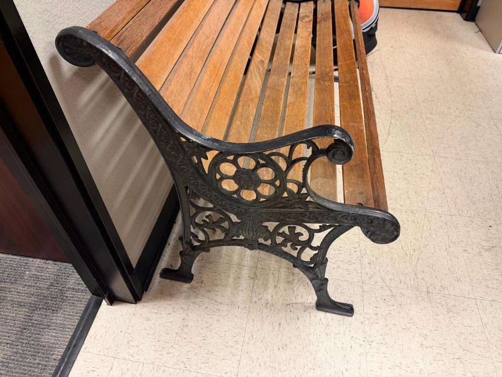 RUSTIC WOOD BENCH FEATURING BLACK CAST IRON LEGS WITH ORNATE DETAILS WITH LIONS AND FLORAL PATTERN - 3