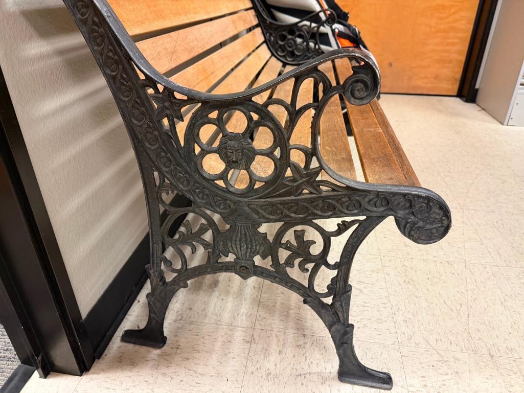 RUSTIC WOOD BENCH FEATURING BLACK CAST IRON LEGS WITH ORNATE DETAILS WITH LIONS AND FLORAL PATTERN - 4