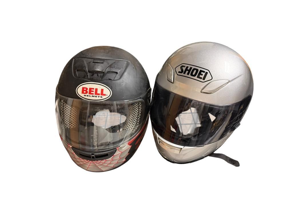 SHOEI AND BELL MOTOCYCLE HELMETS: BELL FEATURES RED FLAME DESIGN WITH SPIDERWEB, SHOEI RF-1000 METALLIC SILVER HELMET, BOTH DOT SNELL APPROVED SIZE M/L, SHOEI IS IN GOOD CONDITION OTHER IS FAIR WITH GOOD INTERIOR