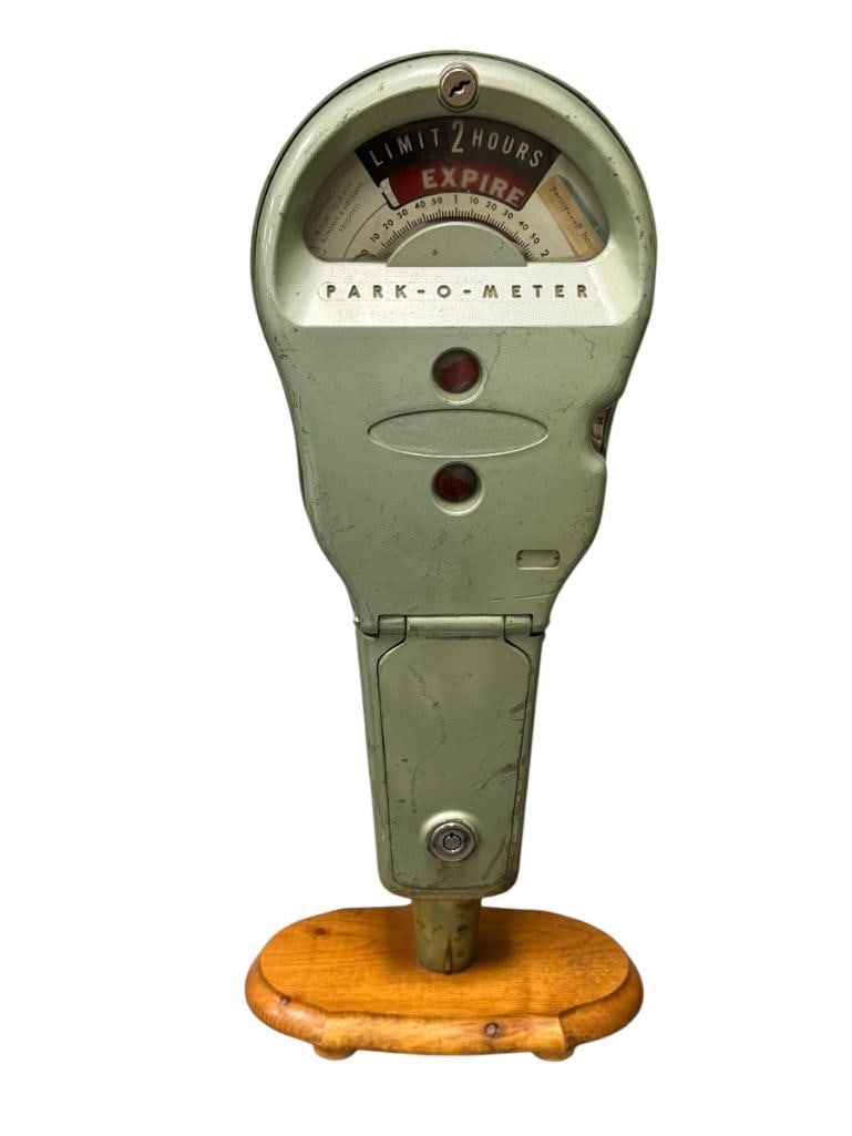 1940'S - 1950'S ROCKWELL MANUFACTURING CO. PARK-O-METER PARKING METER: 2HR LIMIT MODEL, CAST METAL BODY MOUNTED ON WOOD BASE FOR DISPLAY, GLASS IS INTACT 20" H