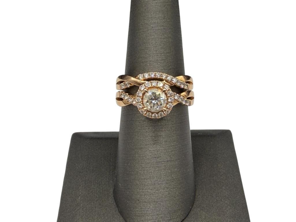 18K ROSE GOLD DESIGNER HALLMARKED DIAMOND ENGAGEMENT SET: FEATURING TWO RINGS WITH WOVEN BAND DESIGN, CENTER ROUND BRILLIANT CUT DIAMOND ACCENTED BY 42 ROUND BRILLIANT CUT DIAMONDS SIZE 7, .85CT CENTER DIAMOND ACCENTED BY .22CTTW ADDITIONAL DIAMONDS, 8.74
