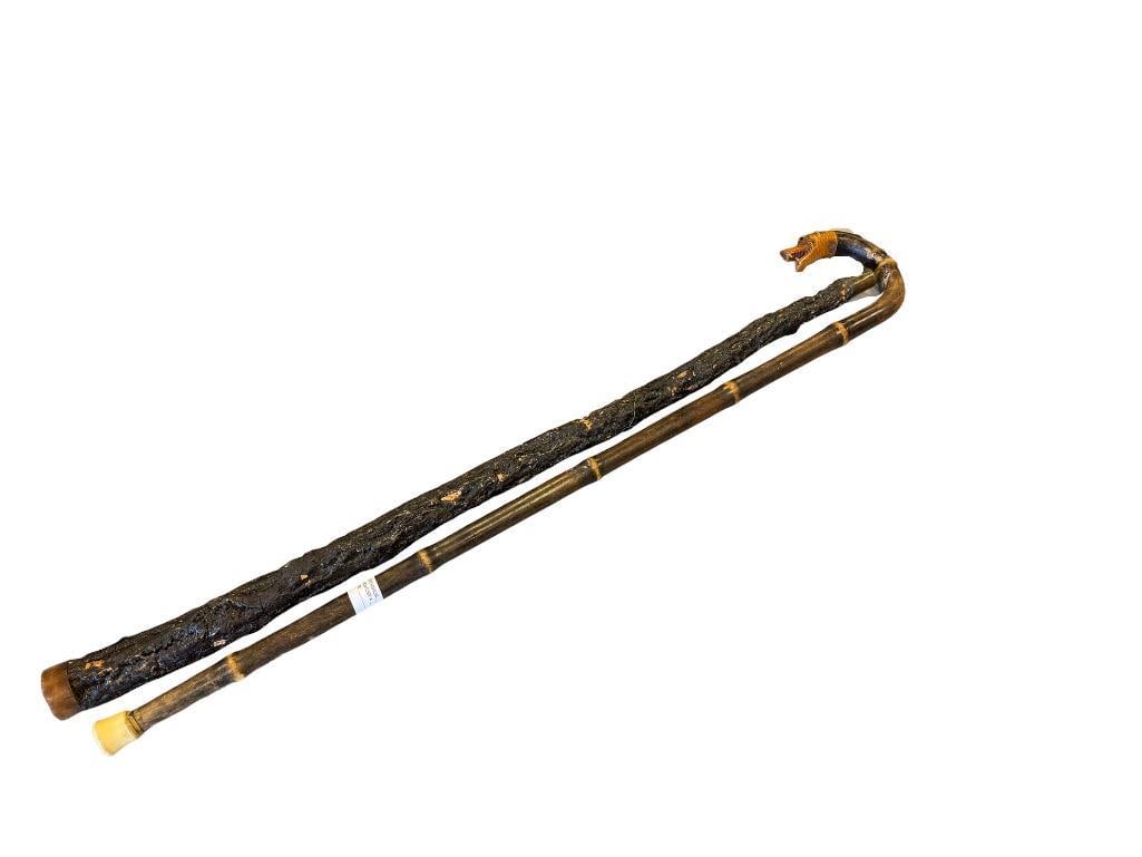 VINTAGE BAMBOO AND GNARLED WALKING STICK: BAMBOO CANE FEATURES BENT HANDLE WITH ANIMAL CARVED END 35" AND 36" L