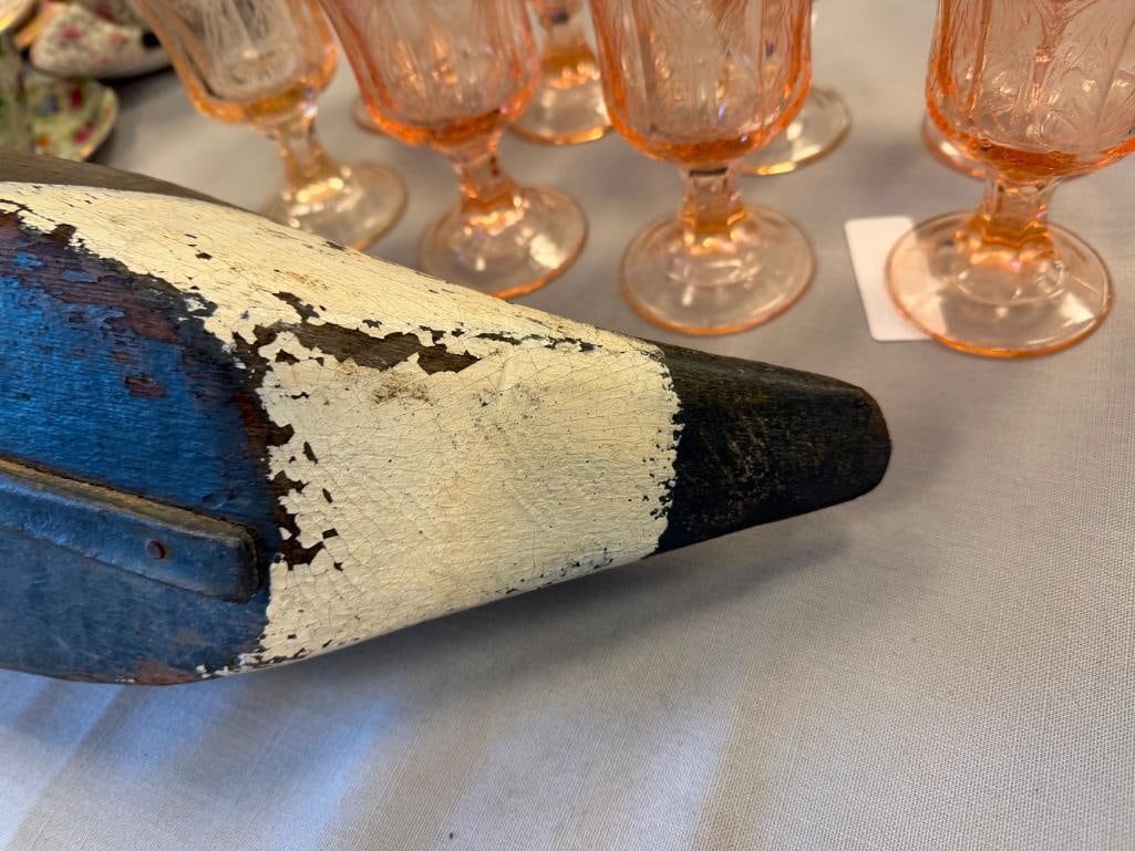 EARLY 20TH CENTURY ANTIQUE HAND CARVED WOODEN DUCK DECOY WITH GLASS EYES AND LEAD WEIGHT: HAND PAINTED WOODEN DUCK DECOY, FEATURES AMBER GLASS EYES AND LEAD WEIGHT, TAIL FEATHER IS DAMAGED, PAINT WEAR FROM USE / AGE 18" L