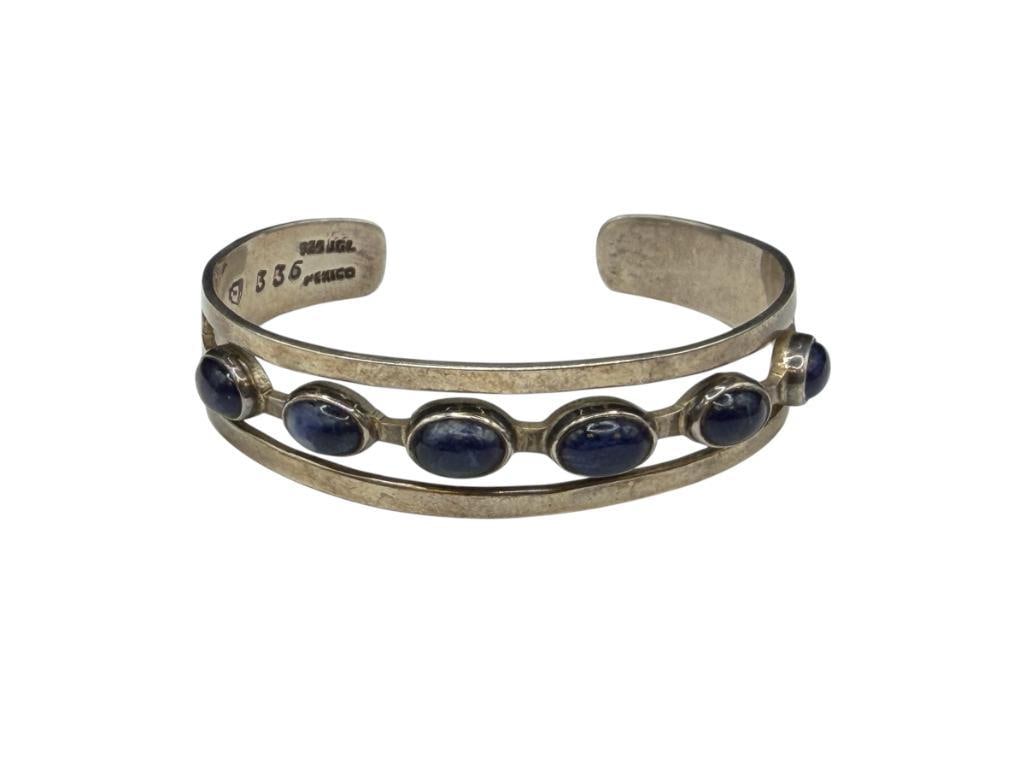 VINTAGE MEXICO ARTIST SIGNED STERLING SILVER OVAL CABOCHON BLUE STONE CUFF BRACELET: MARKED WITH "3" IN BAG AND "336", SIX STONES 2 3/8" CUFF WRIST WIDTH X 5/8" THICK, 8MM STONES, 25.59 GRAMS