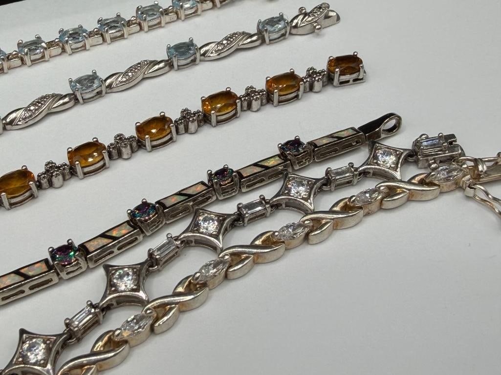 SIX STERLING SILVER TENNIS BRACELETS FEATURING BLUE TOPAZ, CITRINE, CZS, AND OPALITE - 3