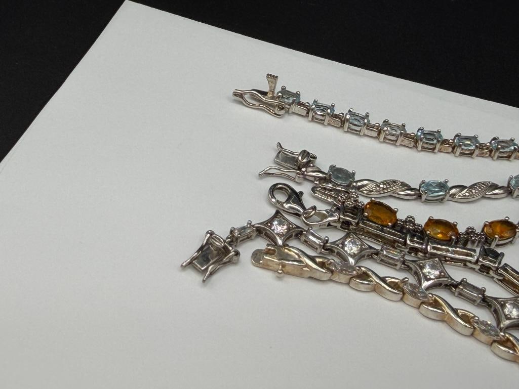 SIX STERLING SILVER TENNIS BRACELETS FEATURING BLUE TOPAZ, CITRINE, CZS, AND OPALITE - 5
