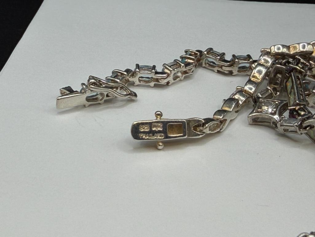 SIX STERLING SILVER TENNIS BRACELETS FEATURING BLUE TOPAZ, CITRINE, CZS, AND OPALITE - 7