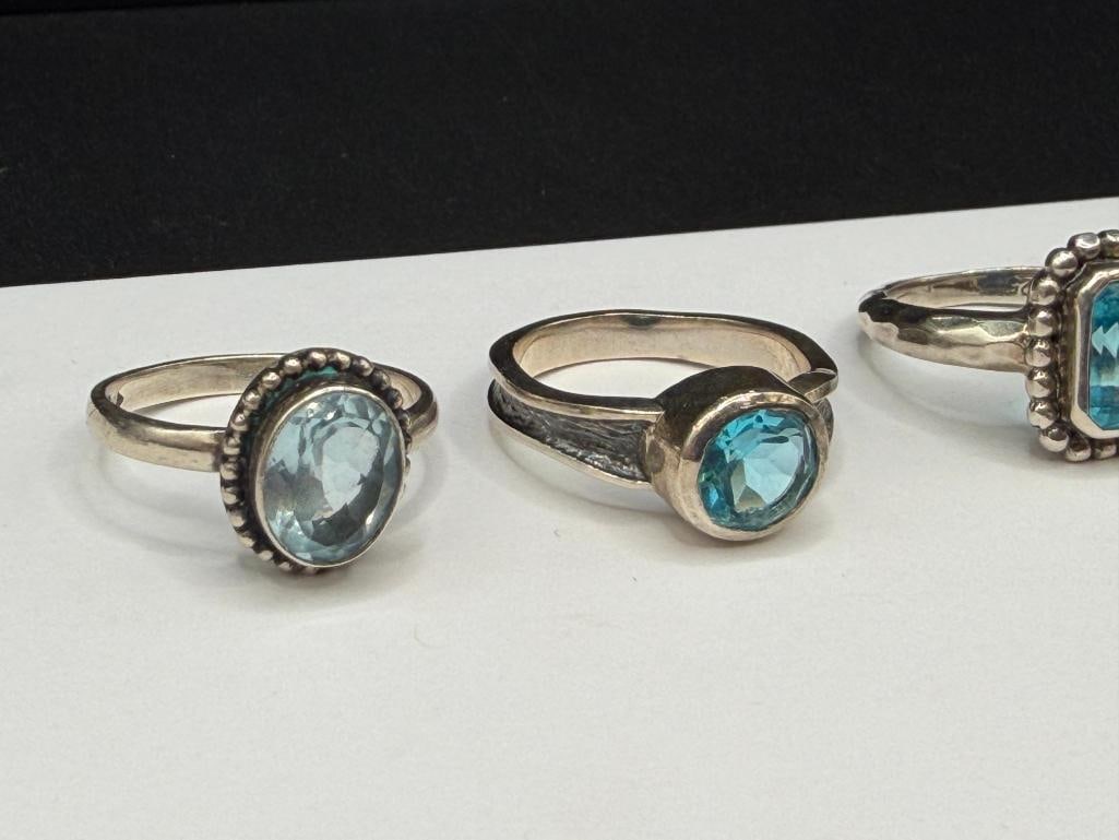 FIVE STERLING SILVER BLUE TOPAZ AND BLUE STONE RINGS - 4