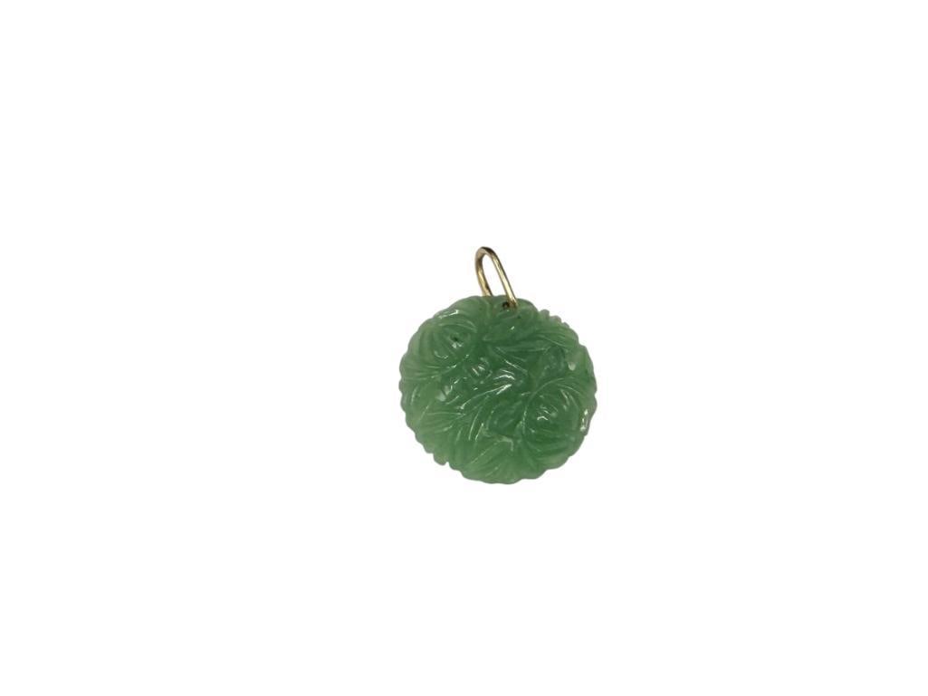 ASIAN CARVED GREEN JADEITE FLORAL DESIGN PENDANT WITH 14K YELLOW GOLD BAIL: 1 1/8", 3.24 GRAMS