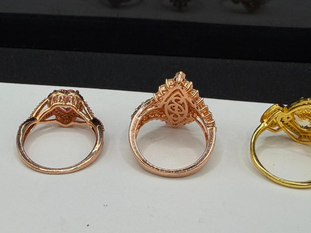 THREE STERLING SILVER ROSE GOLD PLATED AND GOLD-PLATED CZ FASHION RINGS - 6