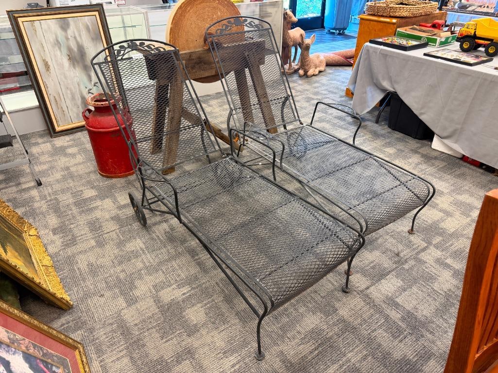 TWO METAL LOUNGE CHAIRS: BLACK FINISH, FEATURES ADJUSTABLE BACK WITH REAR WHEELS 75" L