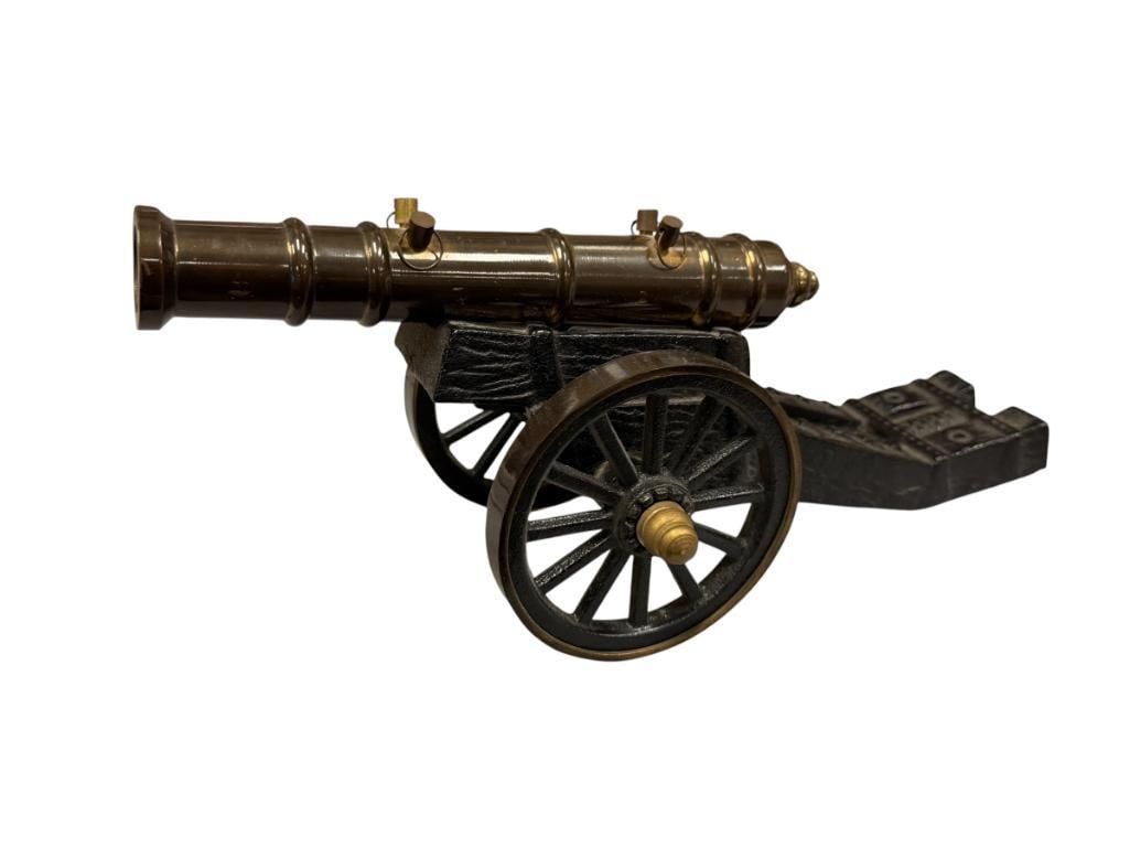 DECORATIVE CAST IRON AND BRASS SIGNAL CANON: BRASS BARREL WITH CAST IRON FRAME AND WHEELS, FOR DECORATION 8 1/2" BARREL, 12 3/4" OVERALL LENGTH