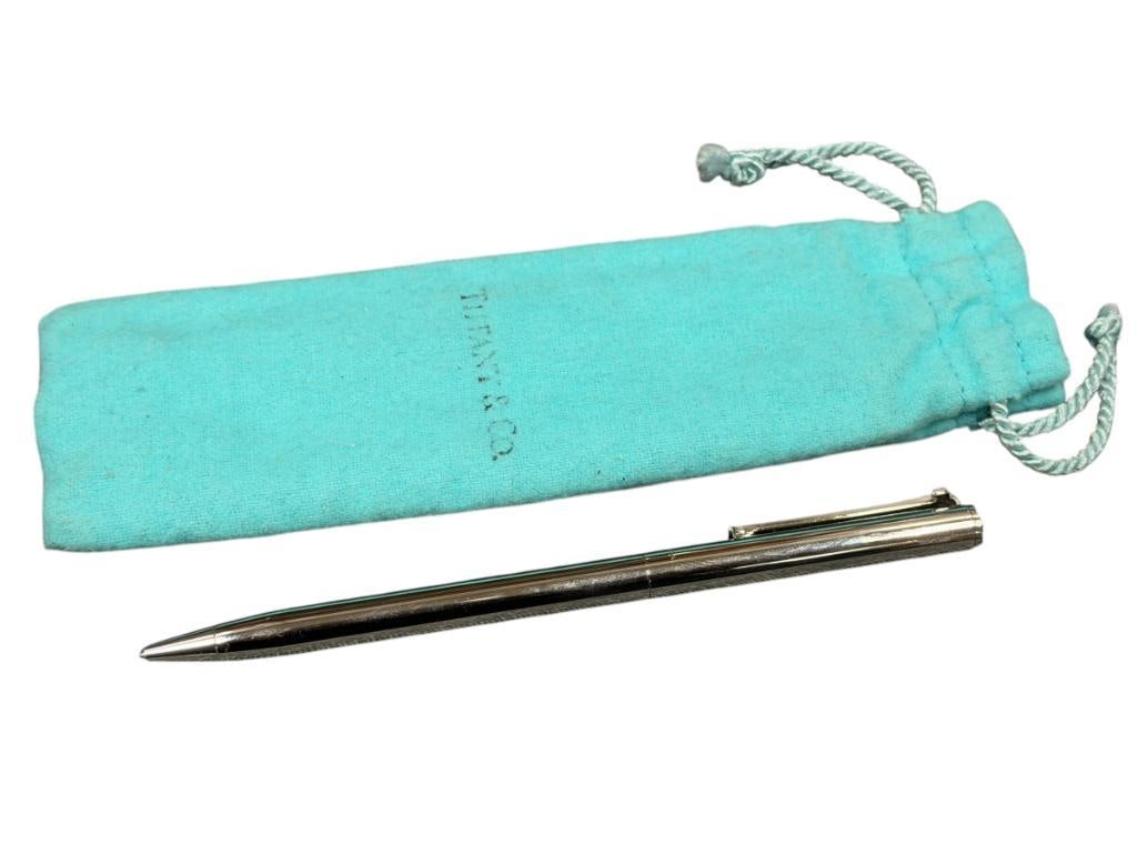 TIFFANY & CO. STAINLESS STEEL T-CLIP BALLPOINT PEN: INCLUDES ORIGINAL POUCH, BLACK LETTERING IS HEAVILY FADED 5 1/8" L