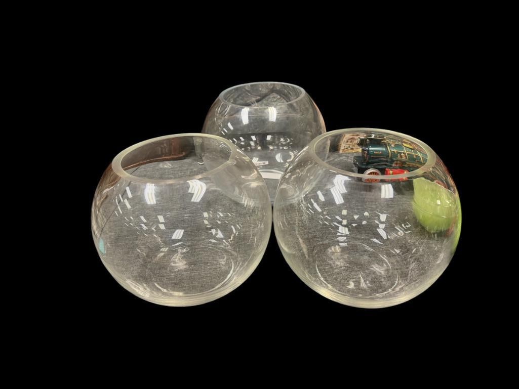 THREE LARGE CLEAR GLASS FLOWER BOWLS: ONE HAS CHIP ON THE INNER EDGE 9 1/2" ROUND, 7 3/4" H