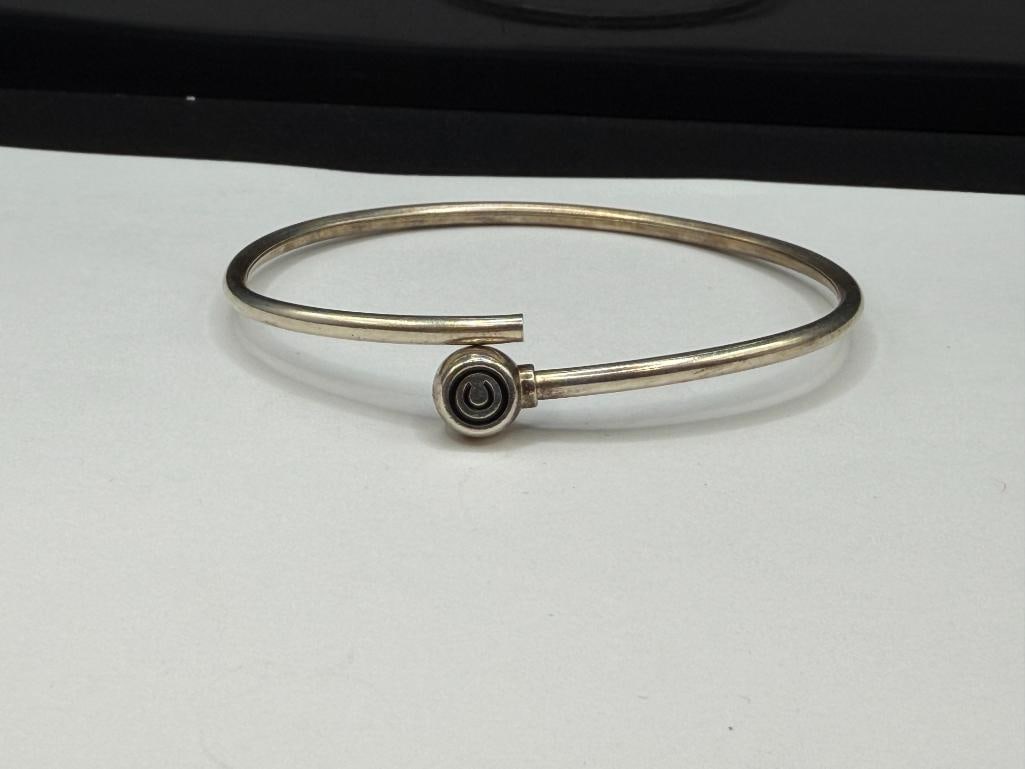 STERLING SILVER BYPASS BANGLE BRACELET WITH COPYRIGHT "C" DESIGN - 3