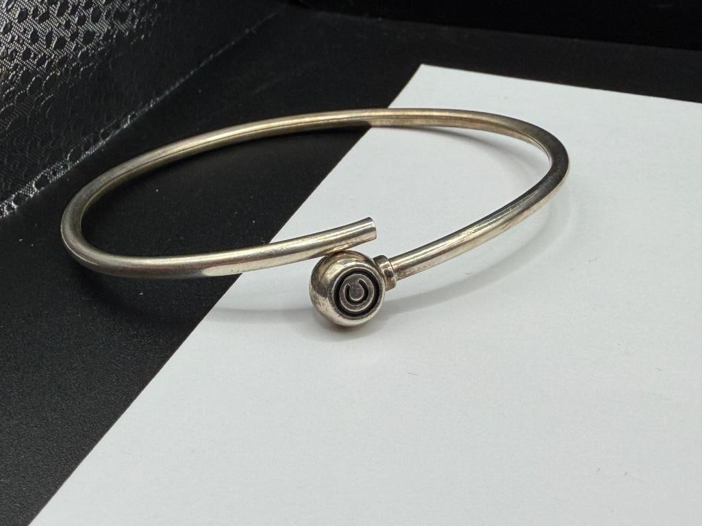 STERLING SILVER BYPASS BANGLE BRACELET WITH COPYRIGHT "C" DESIGN - 4