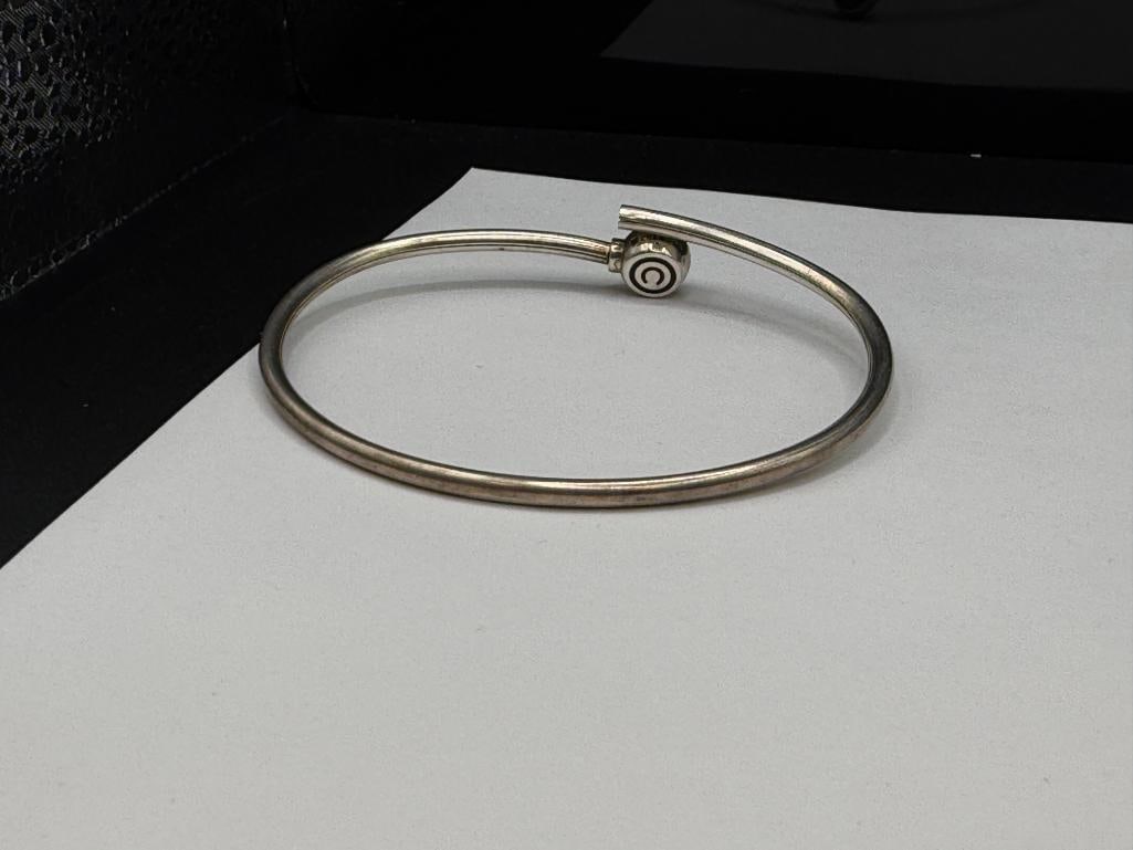 STERLING SILVER BYPASS BANGLE BRACELET WITH COPYRIGHT "C" DESIGN - 5