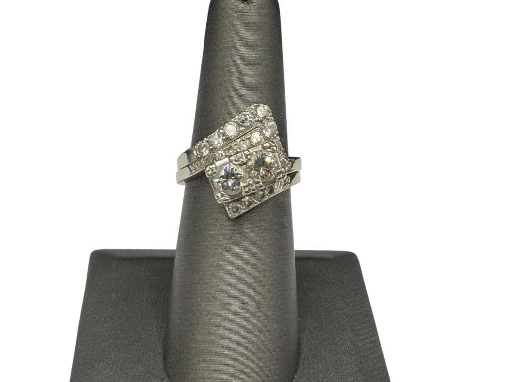 14K WHITE GOLD DIAMOND ENGAGEMENT SET FEATURING ROUND BRILLIANT CUT DIAMONDS: FEATURING A UNIQUE BYPASS DESIGN WITH TWO ROUND BRILLIANT CUT DIAMONDS SET RECTANGULAR PRONG SETTING ACCENTED BY EIGHT ADDITIONAL GRADUATED ROUND CUT DIAMONDS, ADDITIONAL BAND FEATURES UNIQUE SHAPE