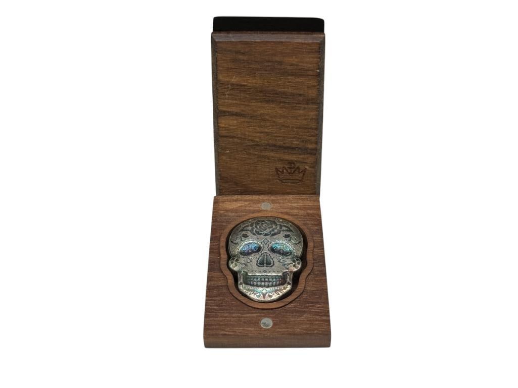 UNIQUE MEXICO DESIGN DECORATED SKULL .999 FINE SILVER ART BAR WITH WOOD BOX: BOX MARKED WITH "P" ABOVE CROWN 2 TROY OUNCES, 1 1/2"