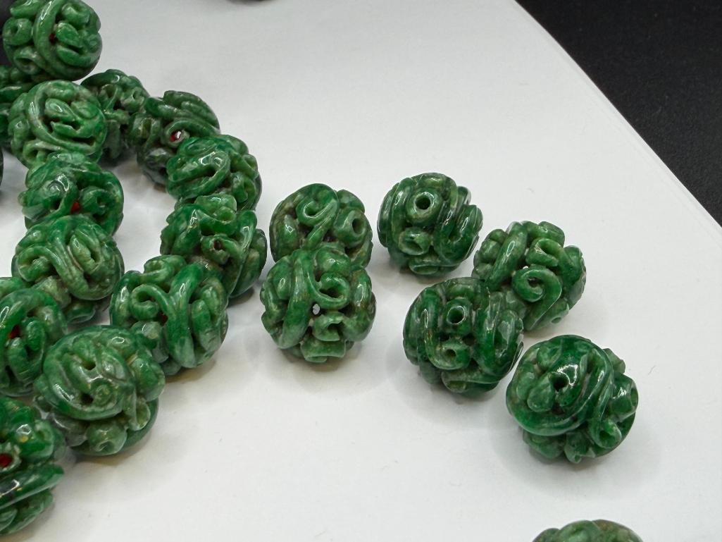109 CARVED GREEN SPINACH JADEITE BEADS INCLUDING MOST STRUNG ON RED THREAD - 5