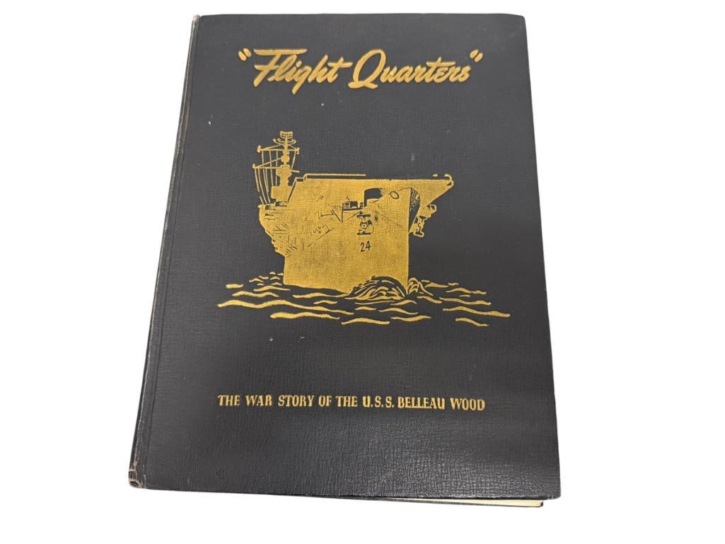 1946 FLIGHT QUARTERS THE WAR STORY OF THE U.S.S. BELLEAU WOOD: PUBLISHED BY JOHN W. ALEXANDER, LIEUTENANT U.S.N.R., BLUE CLOTH COVERS WITH GILT LETTERING AND ILLUSTRATION, SHOWS WEAR ALONG EDGES AND SPINE 8 1/2" X 11 1/4"