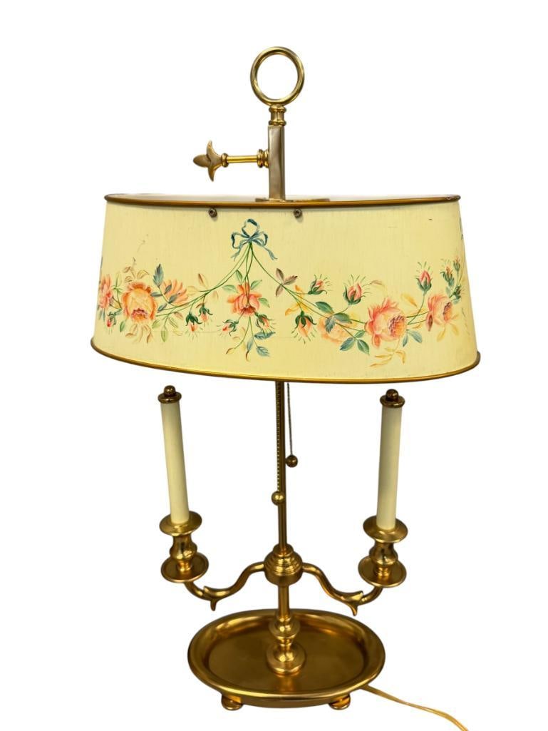 FRENCH BOUILLOTE STYLED TABLE LAMP WITH POLYCHROME FLORAL DESIGN ON THE METAL SHADE: SOLID BRASS BASE, FEATURES TWO ARMS WITH FAUX CANDLESTICKS, DOUBLE STRING PULL, TESTED + 25" H