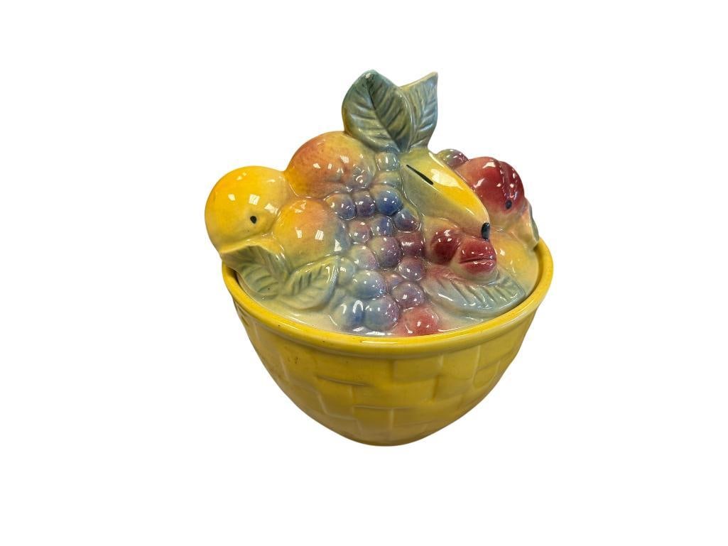 VINTAGE SHAWNEE POTTERY FRUIT BASKET COOKIE JAR NO. 84: COLORFUL FRUIT BASKET POTTERY JAR, MARKED ON THE BOTTOM, SMALL PAINT CHIP ON ONE OF THE LEAVES 8 1/2" H