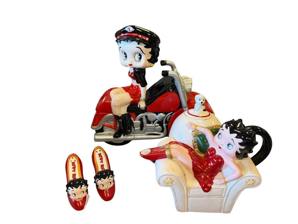 BETTY BOOP CERAMIC HOUSEWARE TEAPOT, COOKIE JAR, AND SALT AND PEPPER SHAKERS: BETTY BOOP ON MOTORCYCLE COOKIE JAR AND BETTY BOOP IN A CHAIR TEAPOT, ON EOF THE HIGH HEEL SHAKERS HAS A CHIP N THE TOP EDGE 9" TEAPOT, 11" JAR