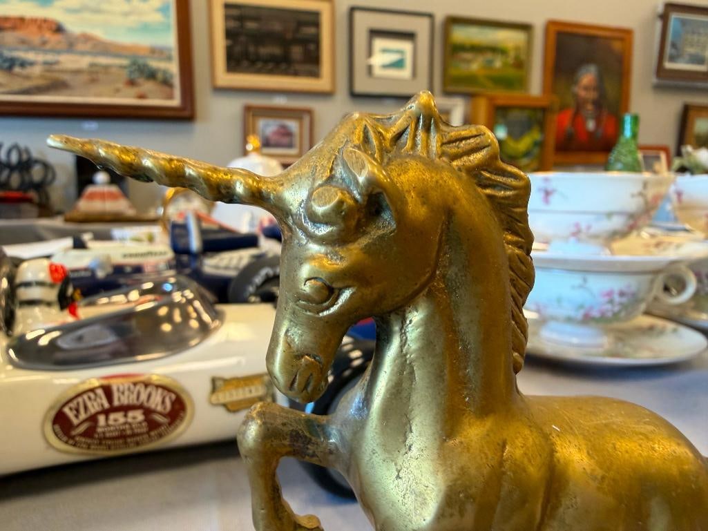 THREE SOLID BRASS UNICRON FIGURINES - 11