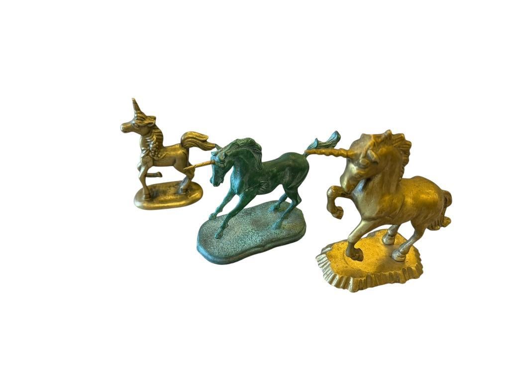 THREE SOLID BRASS UNICRON FIGURINES: ONE HAS WEATHERED PATINA 4" AND 5" H