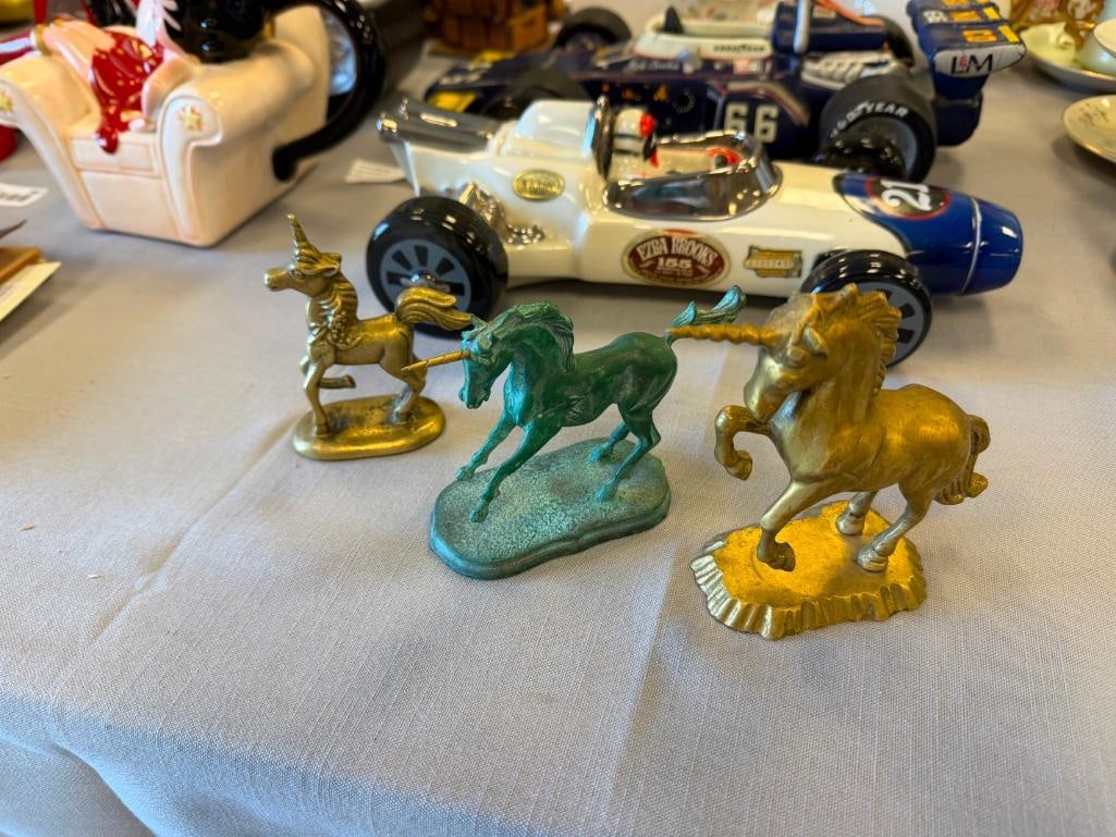 THREE SOLID BRASS UNICRON FIGURINES - 2