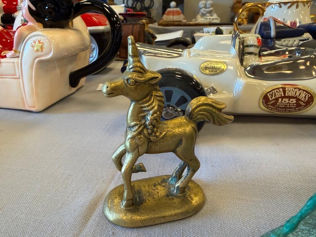 THREE SOLID BRASS UNICRON FIGURINES - 3