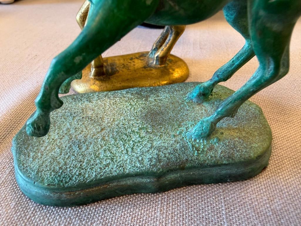 THREE SOLID BRASS UNICRON FIGURINES - 8
