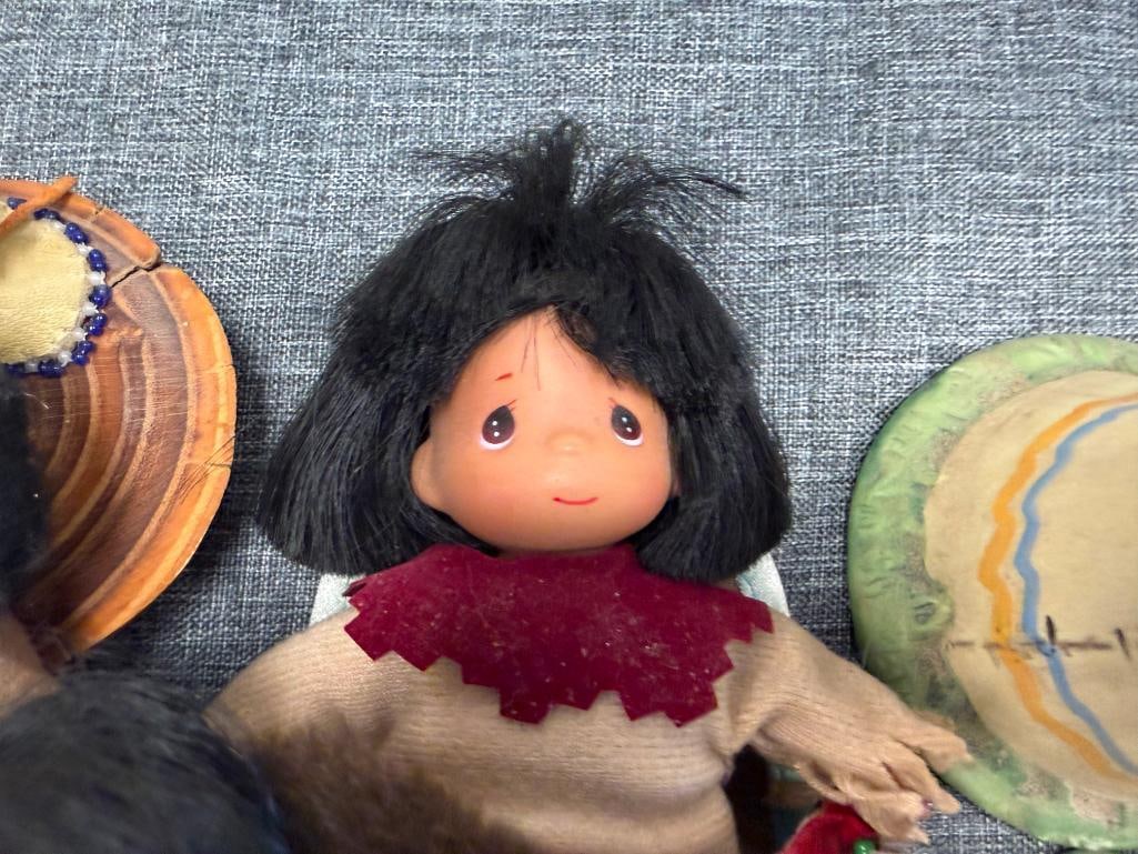 ASSORTED NATIVE AMERICAN CLOTH DOLLS AND 10 CERAMIC NATIVE AMERICAN WOMAN THEMED BELLS - 10