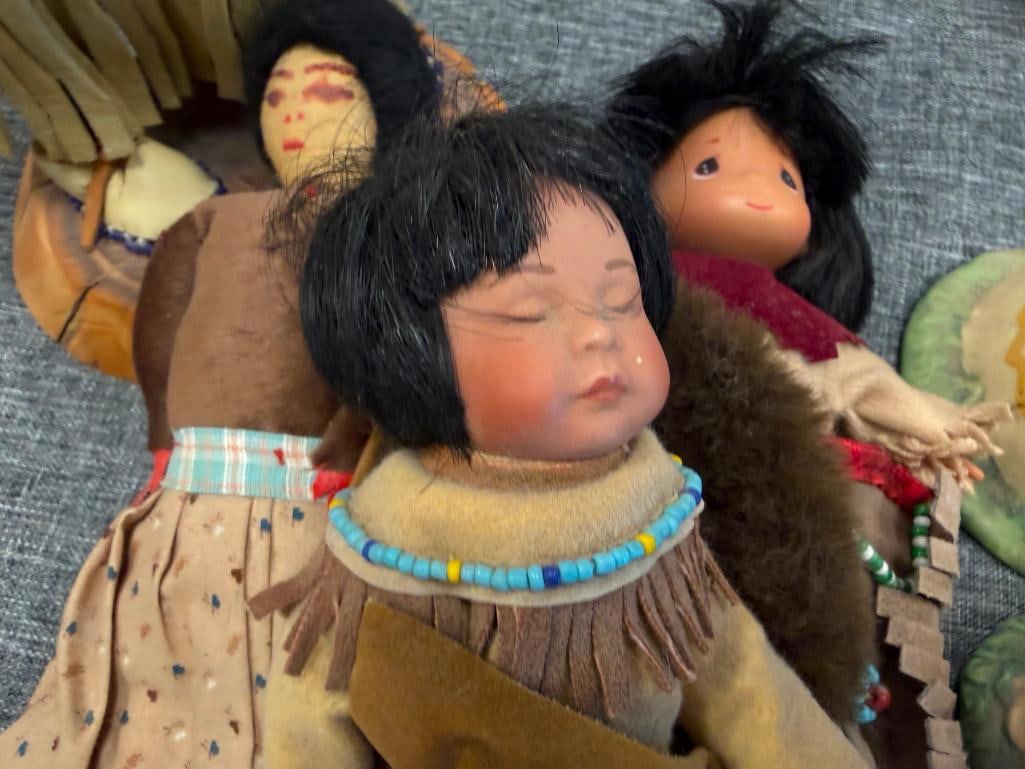 ASSORTED NATIVE AMERICAN CLOTH DOLLS AND 10 CERAMIC NATIVE AMERICAN WOMAN THEMED BELLS - 11