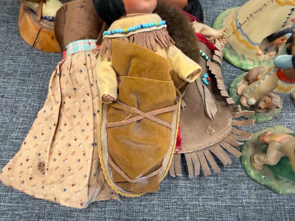 ASSORTED NATIVE AMERICAN CLOTH DOLLS AND 10 CERAMIC NATIVE AMERICAN WOMAN THEMED BELLS - 12