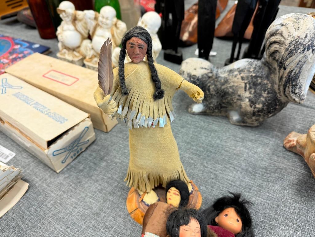 ASSORTED NATIVE AMERICAN CLOTH DOLLS AND 10 CERAMIC NATIVE AMERICAN WOMAN THEMED BELLS - 13