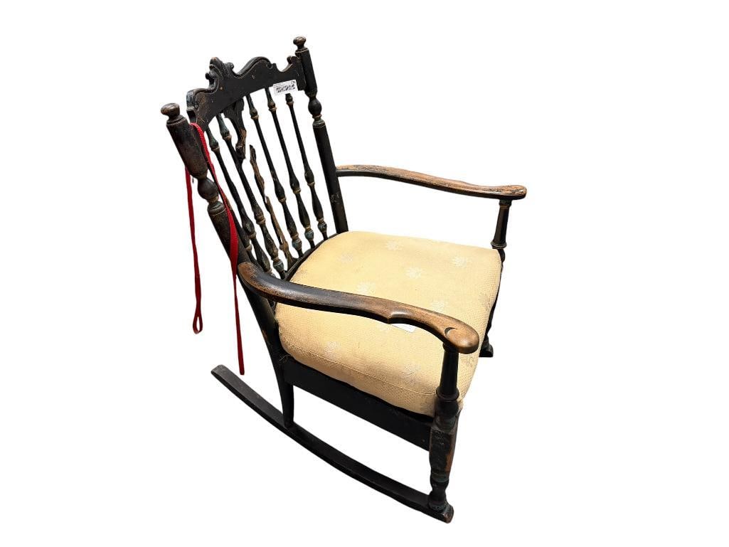 ANTIQUE WOOD ROCKING CHAIR WITH PAINTED BLACK FINISH AND BEIGE SHELL PATTERN UPHOLSTERED SEAT (1 of 5)