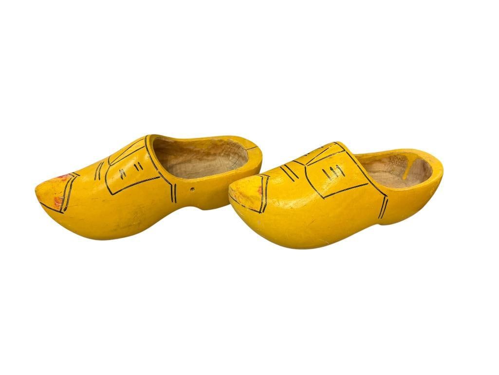 EARLY 20TH CENTURY HAND CARVED DELFT CLOGS: PAINTED YELLOW WITH SKETCHED DESIGN IN BLACK INK 10" L