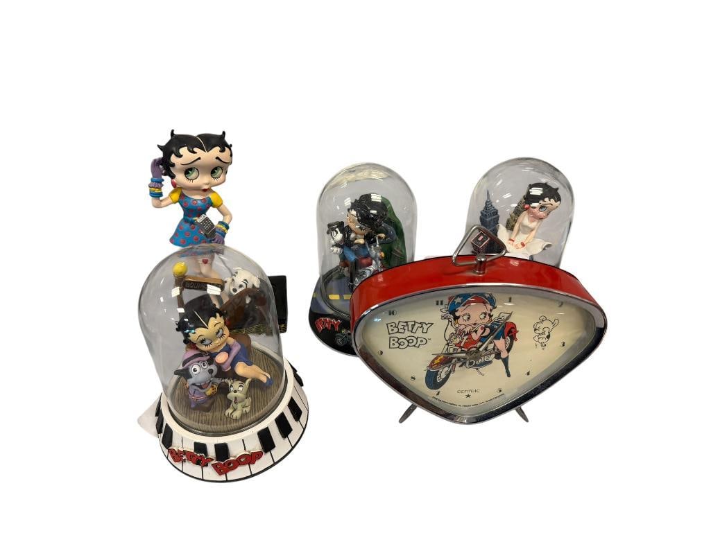BETTY BOOP KING FEATURE SYNDICATE HAND PAINTED SCULPTURES, DANBURY MINT FIGURINE AND QUARTZ CLOCK: THREE HAND PAINTED FIGURINES BY THE FRANKLIN MINT WITH GLASS DOMES, PLUS DANBURY MINT FIGURINE, AND FOUR FRAMED DECOR PRINTS NO DAMAGE OR REPAIRS 5" UP TO 6 1/2" FIGURINES, 10" X 8" FRAMED PRINTS