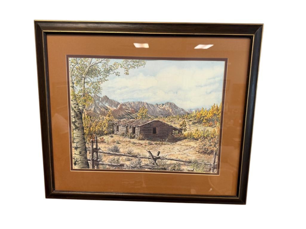 W. LEE SYMMONDS LIMITED EDITION PRINT TITLED ALMOST A MEMORY NO. 150/600: ART DEPICTS LOG CABIN IN FOREST, SURROUNDED BY MOUNTAINS, SIGNED LOWER LEFT, FRAMED 26" X 23" FRAME