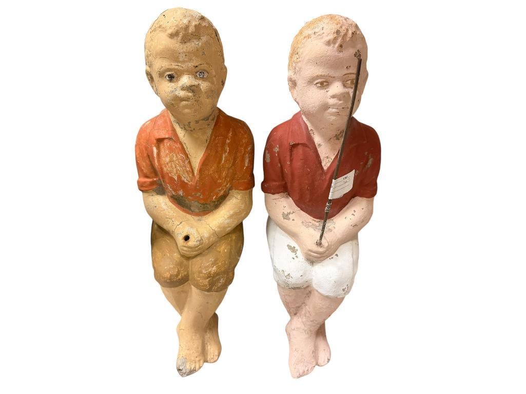 TWO HANDPAINTED SITTING FISHING BOY CEMENT YARD ART SCULPTURES: ONE IS MISSING HIS FISHING POLE, FAIR CONDITION 18" H