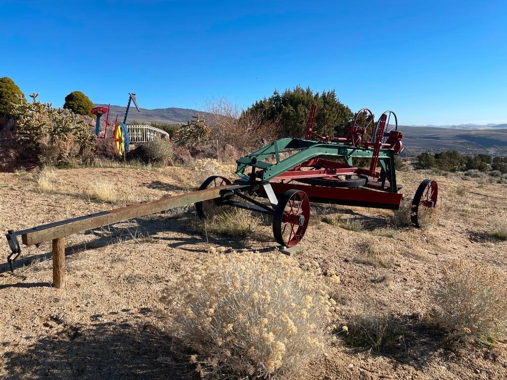 ANTIQUE HACKNEY IRON & STEEL COMPANY HORSE-DRAWN ROAD GRADER OR PLOW EARLY AGRICULTURE IMPLEMENT: FEATURES MANUAL ADJUSTABLE BLADE WITH TWO WHEELS, DRIVERS SEAT WITH PLATFORM, ORIGINAL MANUFACTURE PLATE PRESENT, BLADE MOUNT IS MARKED COLORADO, WHEEL GEARS ARE STAMPED HISCO 20' IN LENGTH, 23" AND