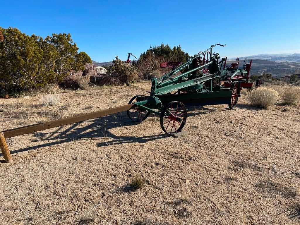 ANTIQUE THE J.D. ADAMS NO. 111 PULL-BEHIND LEANING WHEEL ROAD GRADER EARLY CONSTRUCTION EQUIPMENT: USED IN EARLY 20TH CENTURY TO BUILD AND MAINTAIN ROADS, ORIGINALLY PULLED BY HORSES AND LATER BY TRACTOR, ORIGINAL MANUFACTURE LABEL PRESENT, FEATURES STEEL WHEELS WITH MANUAL OPERATED BLADE, AND