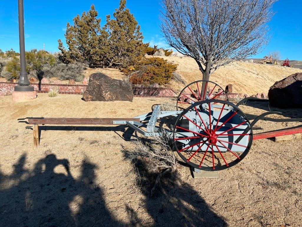 ANTIQUE HORSE-DRAWN AGRICULTURE / FARMING IMPLEMENT CORN STALK CUTTER / PAN SCAPER: SQUARE BUCKET WITH BLADE, MANUAL TILT, WITH LARGE STEEL WHEELS, USED AFTER HARVEST TO CUT CORN STALKS, PREVIOUSLY REPAINTED 15' IN LENGTH, 5' WIDE, 35" WHEELS, 37" X 35" BUCKET