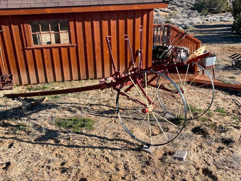 ANTIQUE PARLIN & ORENDORFF CO. HORSE-DRAWN CULTIVATOR PLOW: USED DURING LATE 19TH CENTURY TO EARLY 20TH CENTURY, LARGE STEEL WHEELS WITH LEVERS TO OPERATE BLADE, MANUFACTURE NAME ON SEAT, MISSING PLOW,14' IN LENGTH, 4' WIDE, 38" WHEELS